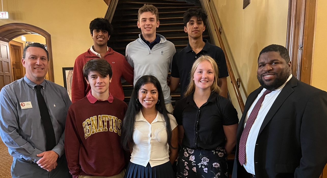 Every student in this picture is wearing a collared shirt